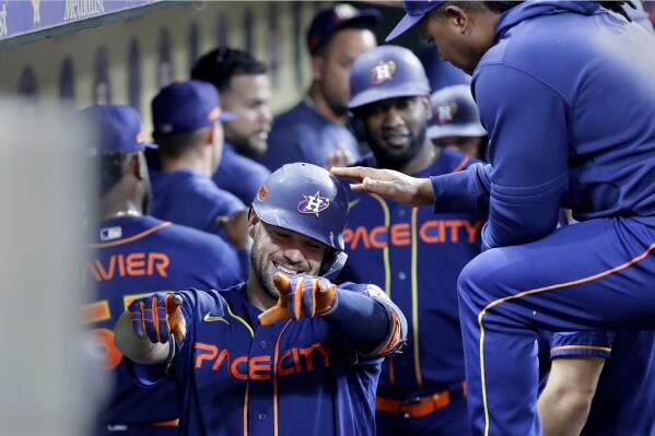 McCormick homers twice and drives in 4 runs to lead the Astros to